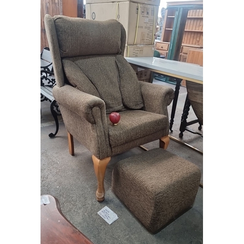 1115 - Upholstered wingback armchair with matching ottoman. Features wooden cabriole legs and textured fabr... 