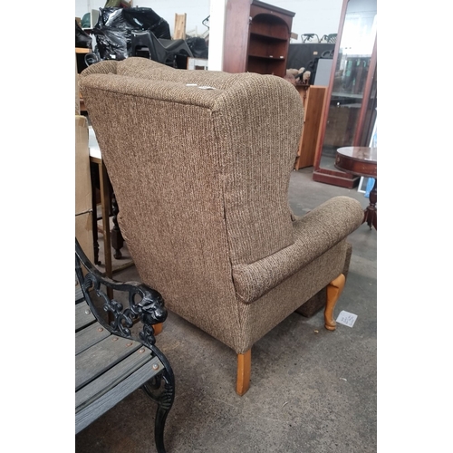 1115 - Upholstered wingback armchair with matching ottoman. Features wooden cabriole legs and textured fabr... 