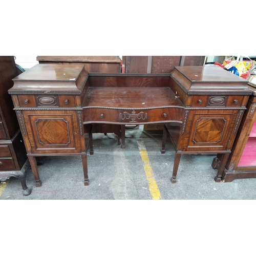 1118 - Star Lot : A stunning Sheraton large sideboard boasting intricate carvings and multiple drawers. The... 