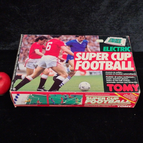 105 - A fantastic and super nostalgic Tomy branded electric Super Cup Football game. Complete in original ... 