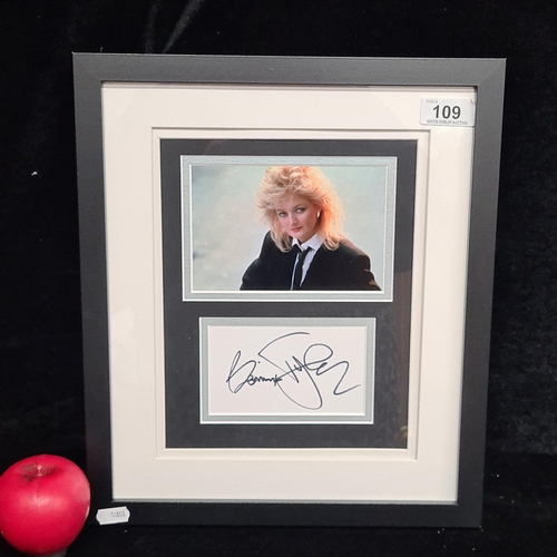 109 - A framed Bonnie Tyler photograph with original hand signature . Certificate of authenticity from 'Sp... 