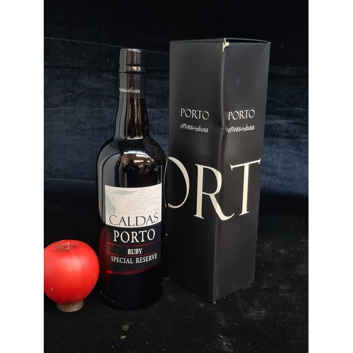 116 - A sealed 750ml bottle of Caldas Porto Ruby special reserve port.