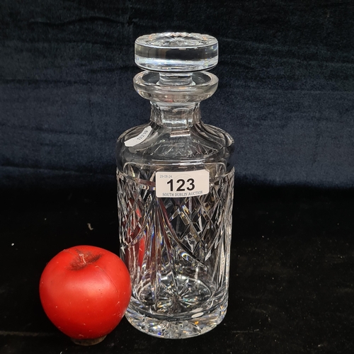 123 - An elegant Waterford Crystal drinks decanter with original stopper and in excellent condition.