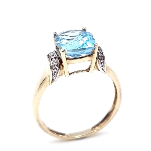 1 - Star Lot : A good quality nine carat gold (375) topaz and diamond ring. Size - P 1/2. Weight - 2.8 g... 