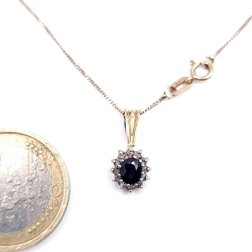 15 - A nine carat gold sapphire and diamond pendant with nine carat gold chain. Weight - 1.83 grams.