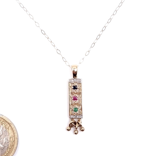 16 - Star Lot : A very pretty nine carat gold drop pendant set with emerald, ruby, sapphire & diamonds wi... 