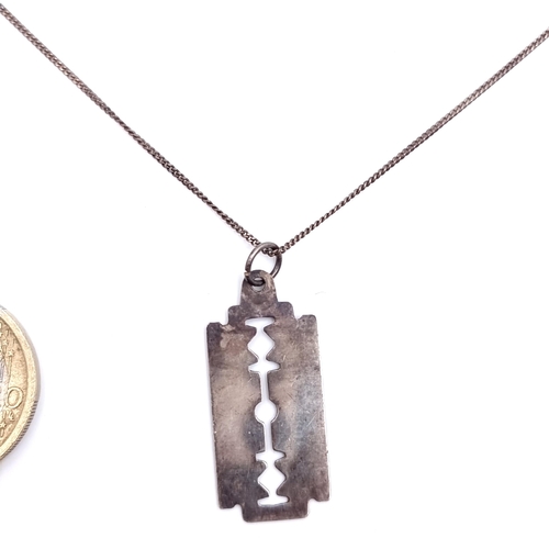 20 - A vintage 925 pendant in the form of a razor blade with chain. Length of chain - 48 cms.