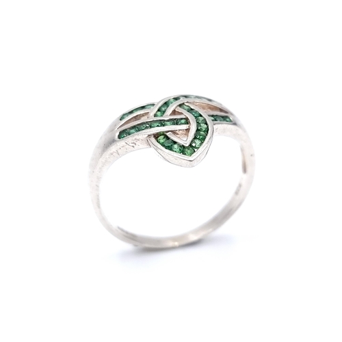 21 - A sterling silver celtic design tourmaline stone ring. Ring size - O. Weight - 2.32 grams.