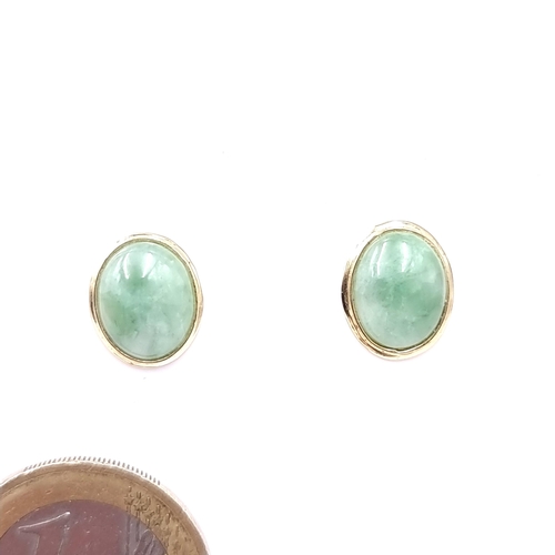 34 - A good pair of 14 carat gold jade stud earrings. Weight - 1.66 grams.