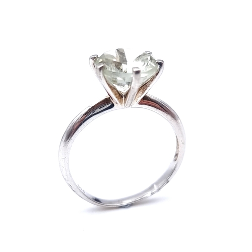 40 - A pretty green Moissanite Solitaire  gemstone ring mounted in sterling silver. Ring size - R. Weight... 