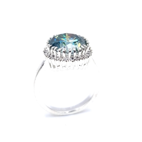 41 - A beautiful blue moissanite stone ring with gemstone surround mounted in sterling silver. Ring size ... 