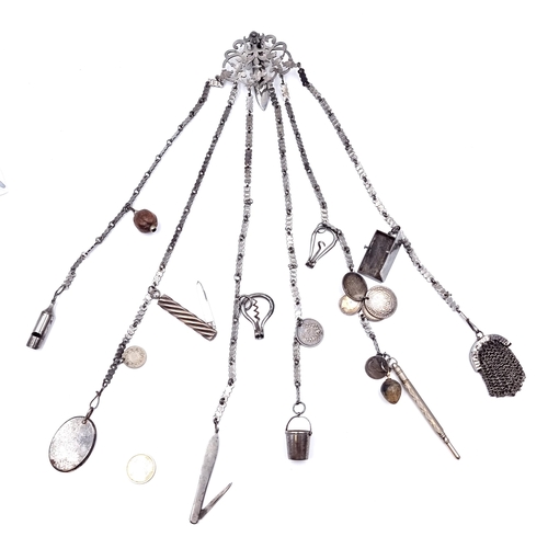 49 - Star Lot : A fine example of a Chatelaine with numerous items. Length - 38 cms. The chatelaine has n... 