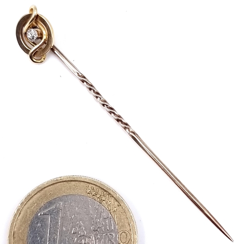 5 - A vintage 15 carat gold diamond set tie pin. Length - 5 cms. Weight - 1.28 grams.