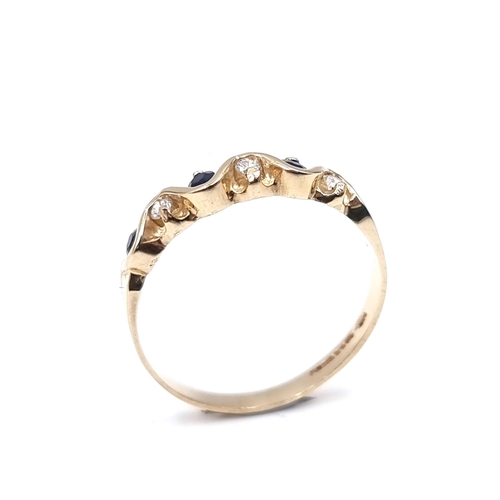 6 - Star Lot : A diamond and sapphire twist set mounted ring in nine carat gold. Size - M 1/2. Weight - ... 