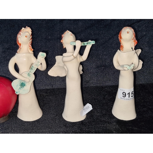 915 - Three Kildare art studio pottery evangelic themed figures. SD to wings.