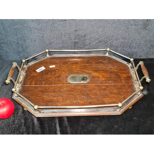 929 - A wonderful antique  octagonal antique walnut Butler's serving tray. Sat on bun feet.