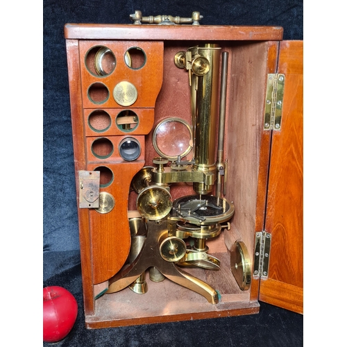 930 - Super star lot : A stunning antique solid brass microscope with additional lenses and housed in a be... 