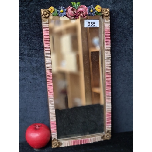 955 - A delightful beveled wall mirror. Housed in gilt frame with floral motifs. 
MM: 20 x 41 cm including... 