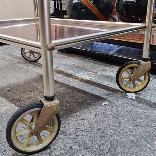 969 - Metal bar cart with faux wood shelves, tubular metal frame, and four caster wheels. Mid-Century Mode... 