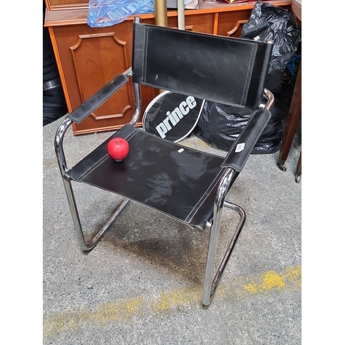 1241 - Star lot : Mid-Century Modern black leather Wassily-style tubular chrome chair. The clean lines and ... 