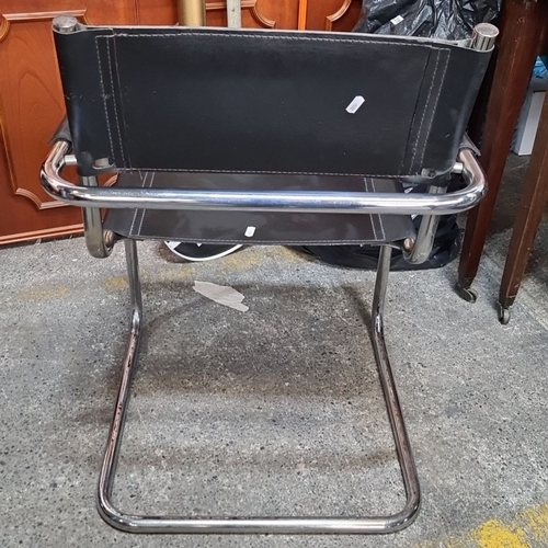 1241 - Star lot : Mid-Century Modern black leather Wassily-style tubular chrome chair. The clean lines and ... 