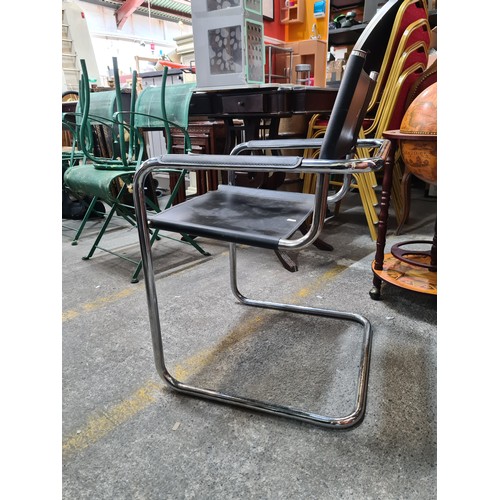 1241 - Star lot : Mid-Century Modern black leather Wassily-style tubular chrome chair. The clean lines and ... 