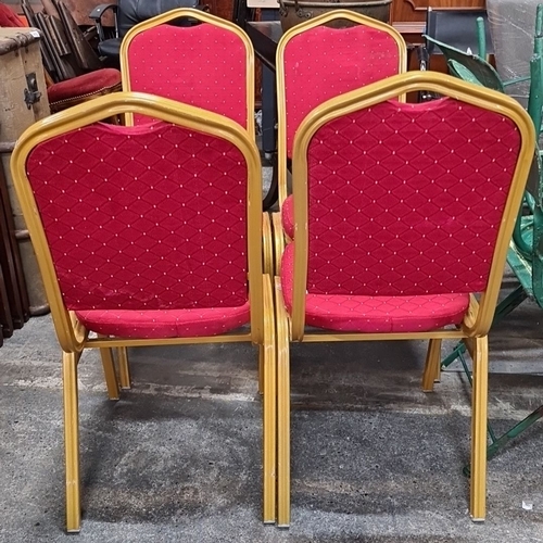 1244 - Set of four red upholstered stackable chairs with gold-tone metal frames. Each chair features a diam... 