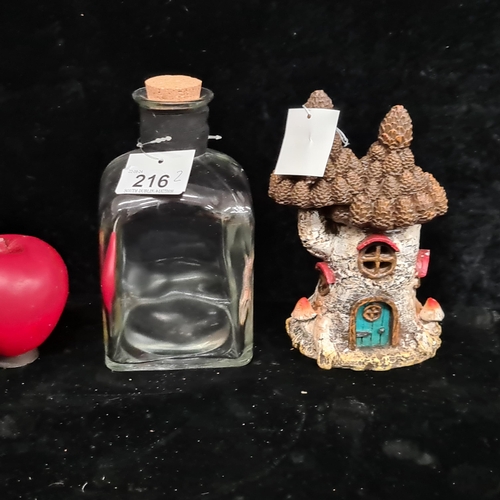 1274 - A French glass decanter with cork stopper together with a whimsical garden fairy house.
Previous in ... 