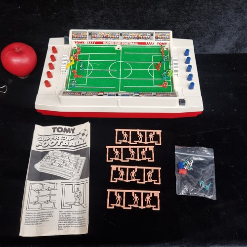 105 - A fantastic and super nostalgic Tomy branded electric Super Cup Football game. Complete in original ... 