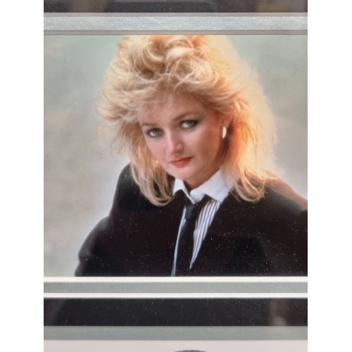 109 - A framed Bonnie Tyler photograph with original hand signature . Certificate of authenticity from 'Sp... 