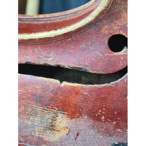 927 - A fantastic antique violin complete with two bows and housed in a hard shell case.