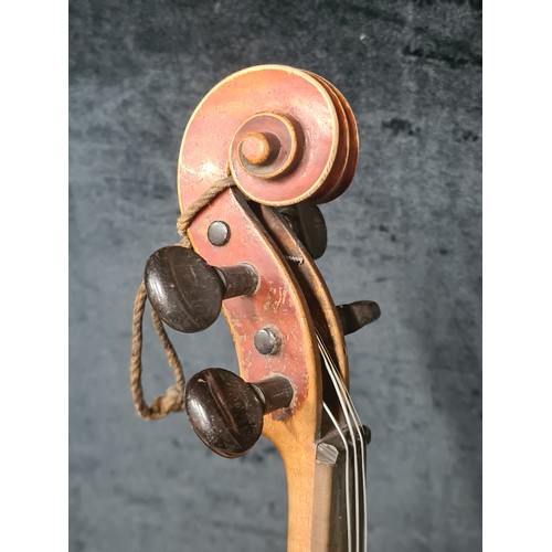 927 - A fantastic antique violin complete with two bows and housed in a hard shell case.