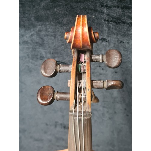 927 - A fantastic antique violin complete with two bows and housed in a hard shell case.