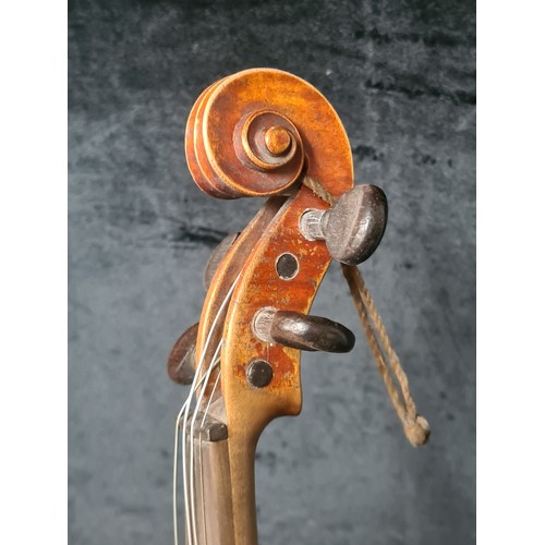 927 - A fantastic antique violin complete with two bows and housed in a hard shell case.