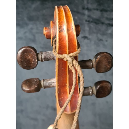 927 - A fantastic antique violin complete with two bows and housed in a hard shell case.