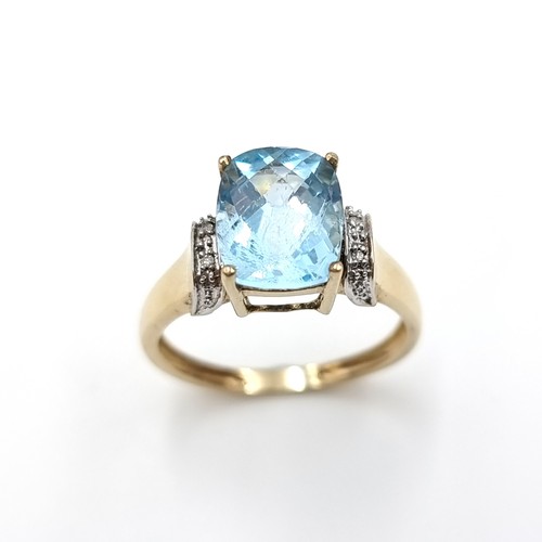 1 - Star Lot : A good quality nine carat gold (375) topaz and diamond ring. Size - P 1/2. Weight - 2.8 g... 