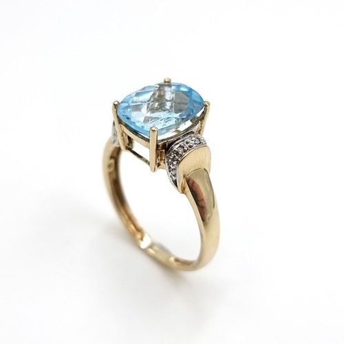 1 - Star Lot : A good quality nine carat gold (375) topaz and diamond ring. Size - P 1/2. Weight - 2.8 g... 