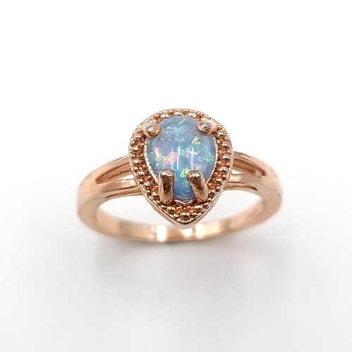 3 - A gold heart shaped fire opal ring set in a silver and gold toned mount. Size - O. Weight - 3 grams.