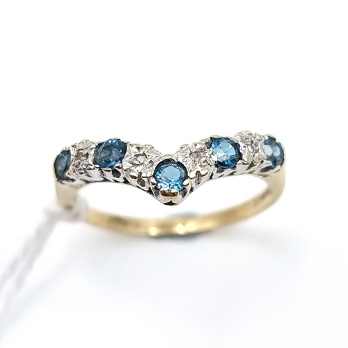 8 - Star Lot : A nine carat gold sapphire and gem set wishbone ring. Size - L 1/2. Weight - 1.8 grams.