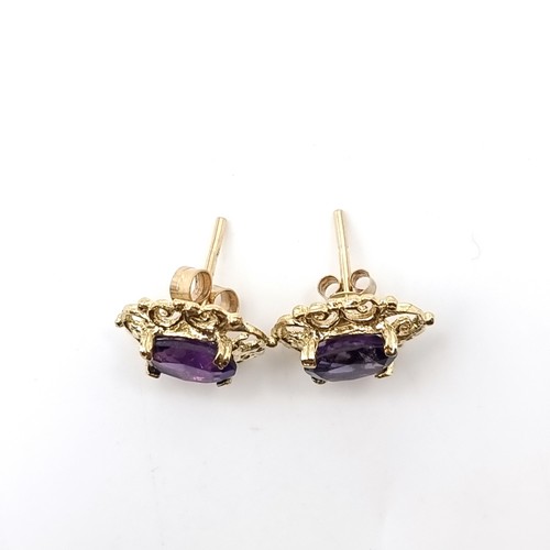 9 - A pair of vintage nine carat gold amethyst stone stud earrings. Weight - 1.65 grams.