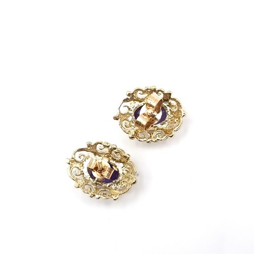 9 - A pair of vintage nine carat gold amethyst stone stud earrings. Weight - 1.65 grams.