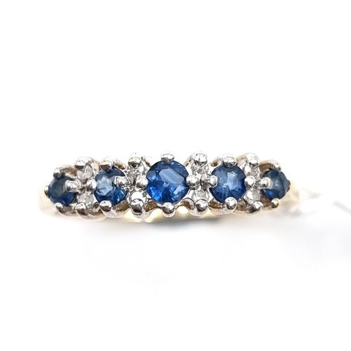 14 - Star Lot : A nine carat gold five stone sapphire & diamond ring. Size - N. Weight - 1.98 grams.