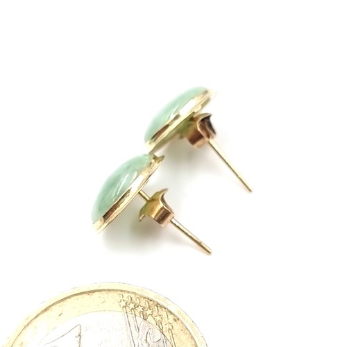 34 - A good pair of 14 carat gold jade stud earrings. Weight - 1.66 grams.