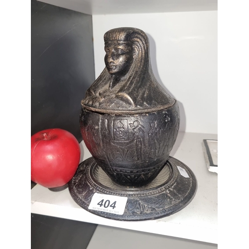 404 - An Egyptian-style lidded urn, intricately cast with hieroglyphic motifs and a pharaoh's head on lid.... 