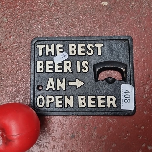 408 - Cast iron wall-mounted bottle opener with the inscription 