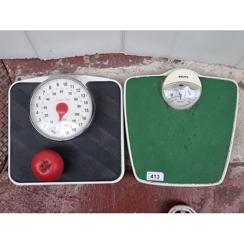 413 - Pair of vintage analogue bathroom scales: Hanson in black with red accents, and Krups in green and w... 