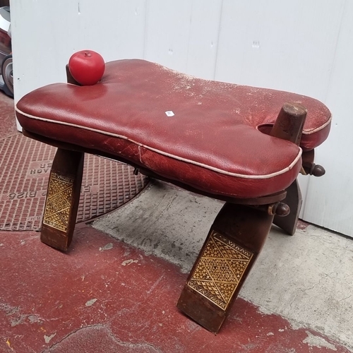 415 - Vintage red leather upholstered footstool with detailed wooden inlay. Features intricate geometric p... 