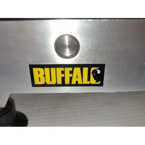 416 - Buffalo electric meat slicer with adjustable blade, stainless steel construction, and safety guard. ... 