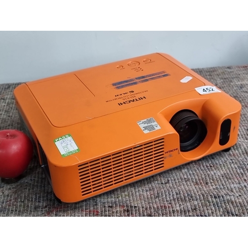 452 - Hitachi ED-X10 Portable LCD Multimedia Projector in orange features a high-resolution lens and multi... 