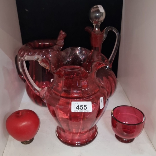 455 - Ruby red glassware set featuring a pitcher, lidded decanter, small bowl, and apple-shaped ornament. ... 